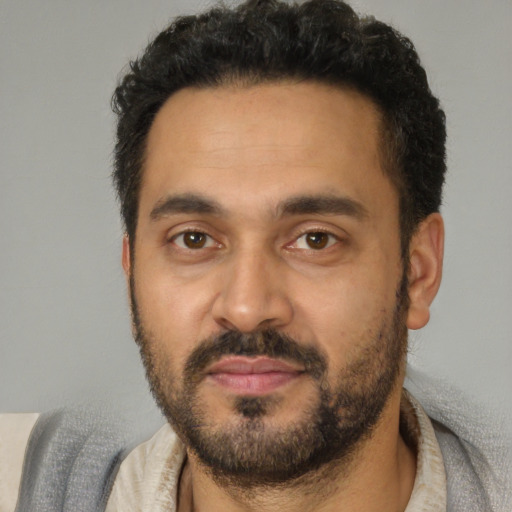Neutral latino adult male with short  black hair and brown eyes