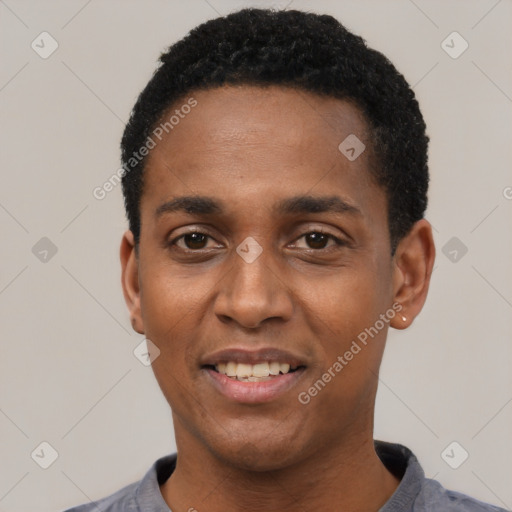 Joyful black young-adult male with short  black hair and brown eyes