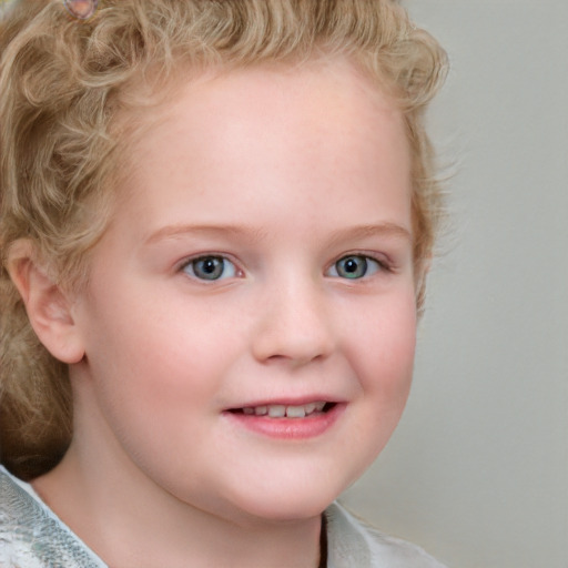 Joyful white child female with short  brown hair and blue eyes