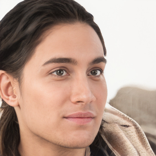 Neutral white young-adult male with long  brown hair and brown eyes