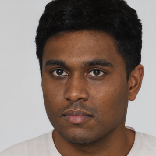 Neutral black young-adult male with short  black hair and brown eyes