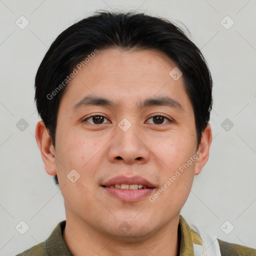 Joyful asian young-adult male with short  brown hair and brown eyes