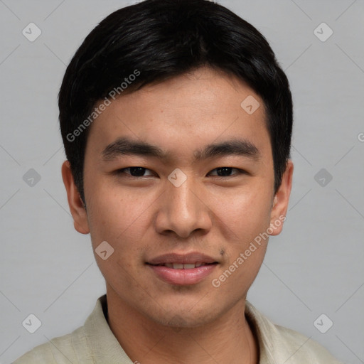 Joyful asian young-adult male with short  black hair and brown eyes