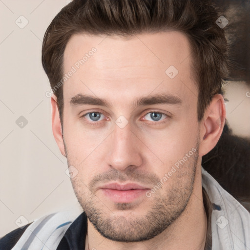 Neutral white young-adult male with short  brown hair and grey eyes