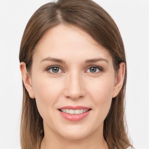 Joyful white young-adult female with long  brown hair and grey eyes