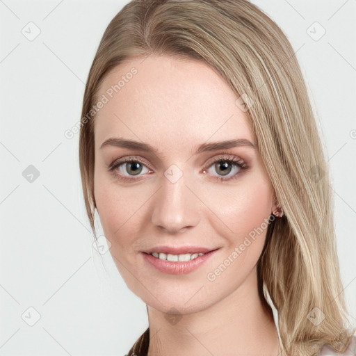 Joyful white young-adult female with long  brown hair and blue eyes