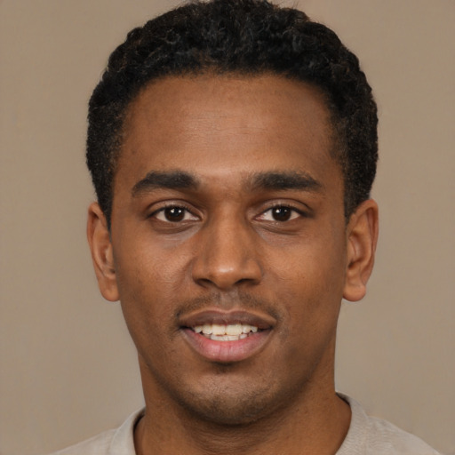 Neutral black young-adult male with short  black hair and brown eyes