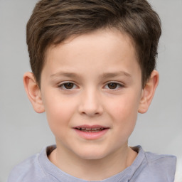 Joyful white child male with short  brown hair and brown eyes