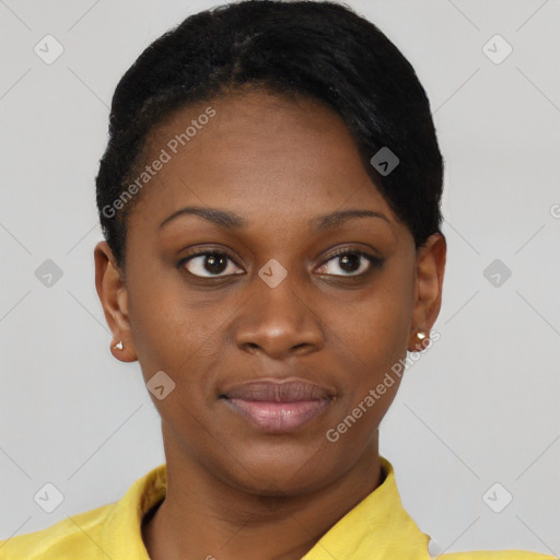 Joyful black young-adult female with short  brown hair and brown eyes