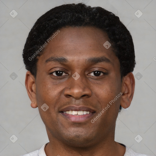 Joyful black young-adult male with short  brown hair and brown eyes