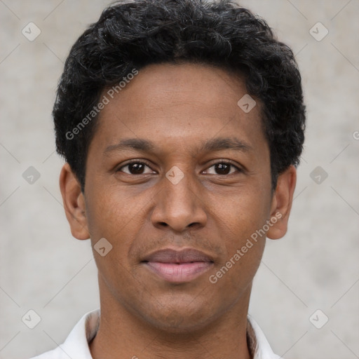 Joyful latino young-adult male with short  brown hair and brown eyes