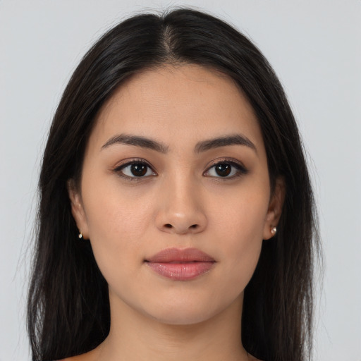 Joyful asian young-adult female with long  brown hair and brown eyes