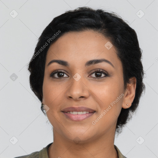 Joyful latino young-adult female with long  brown hair and brown eyes