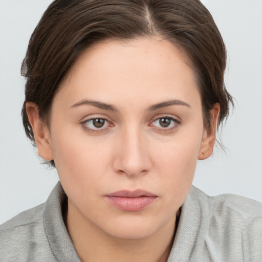 Neutral white young-adult female with short  brown hair and brown eyes