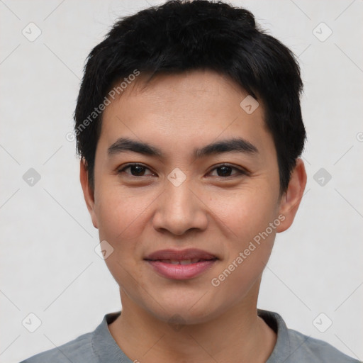 Joyful asian young-adult male with short  black hair and brown eyes