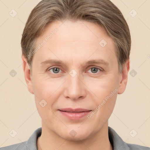 Joyful white adult male with short  brown hair and grey eyes