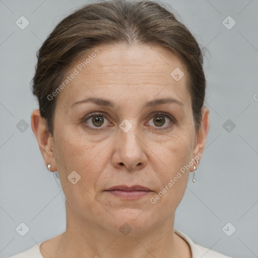 Joyful white adult female with short  brown hair and brown eyes