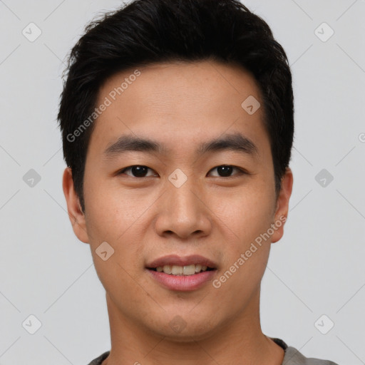 Joyful asian young-adult male with short  black hair and brown eyes