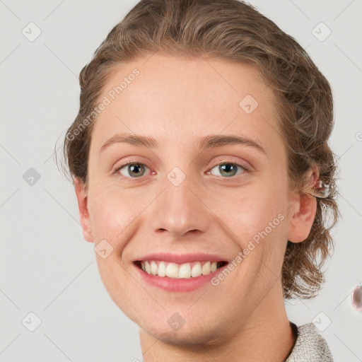 Joyful white young-adult female with medium  brown hair and blue eyes