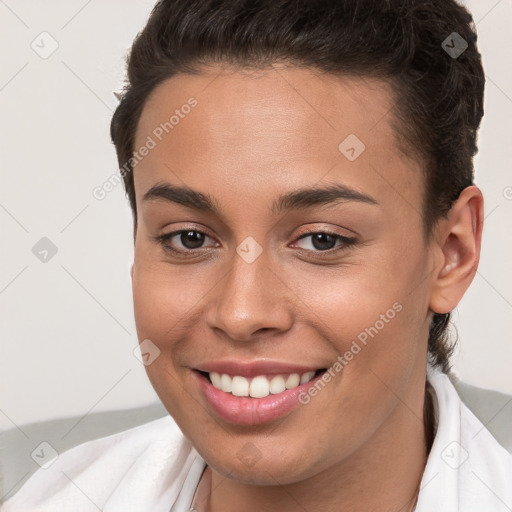 Joyful white young-adult female with short  brown hair and brown eyes