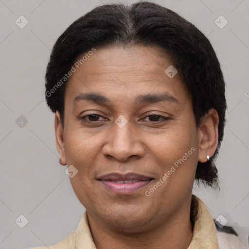 Joyful latino adult male with short  brown hair and brown eyes