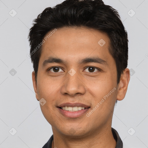 Joyful asian young-adult male with short  black hair and brown eyes