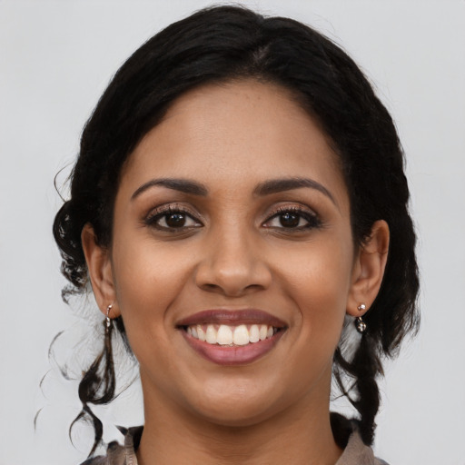 Joyful latino young-adult female with medium  black hair and brown eyes