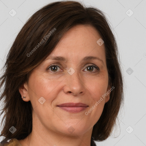 Joyful white adult female with medium  brown hair and brown eyes