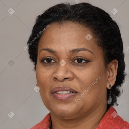 Joyful black adult female with medium  brown hair and brown eyes