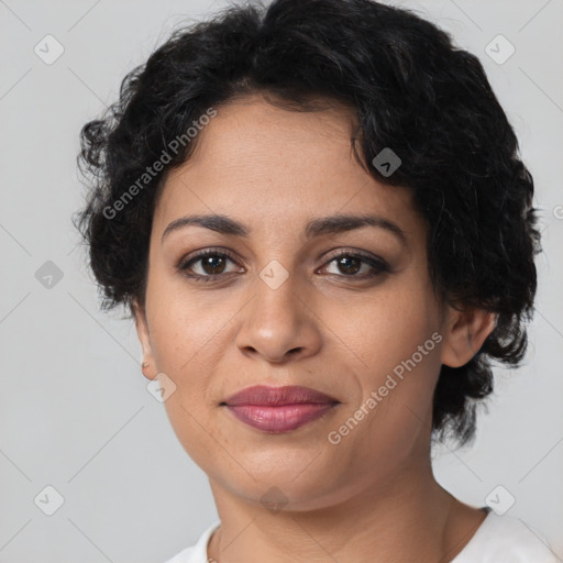 Joyful latino young-adult female with short  brown hair and brown eyes