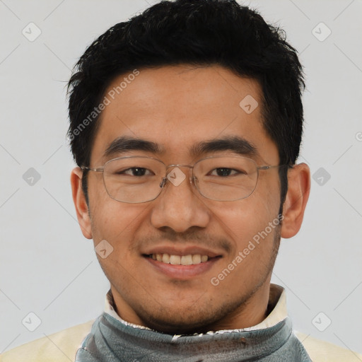 Joyful asian young-adult male with short  black hair and brown eyes