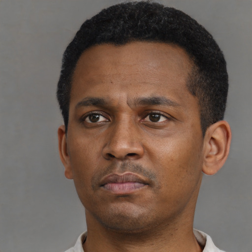 Neutral black young-adult male with short  black hair and brown eyes