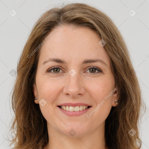 Joyful white young-adult female with long  brown hair and green eyes