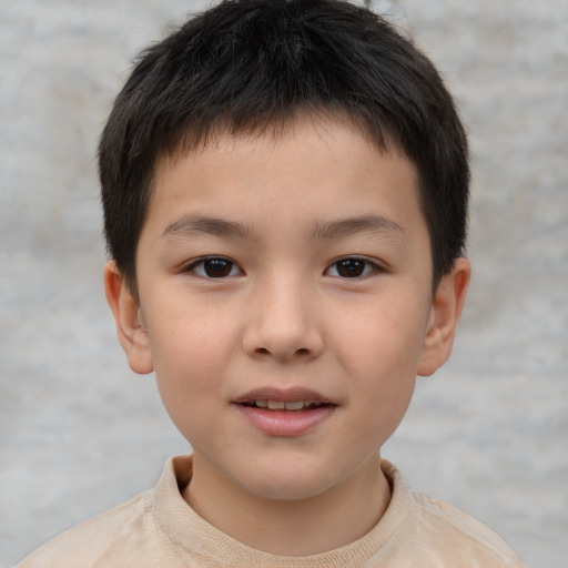 Joyful white child male with short  brown hair and brown eyes