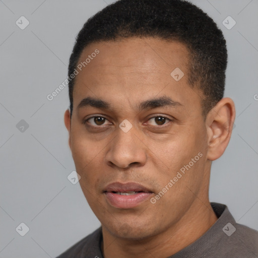 Joyful latino adult male with short  black hair and brown eyes