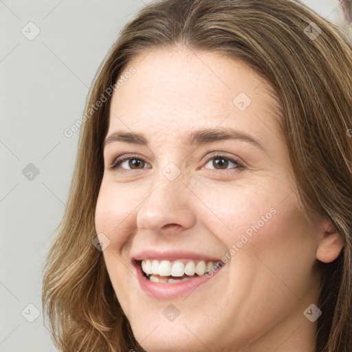 Joyful white young-adult female with long  brown hair and grey eyes