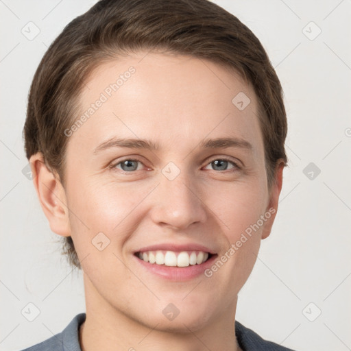 Joyful white young-adult female with short  brown hair and grey eyes