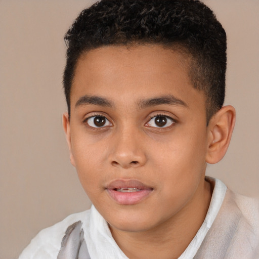 Joyful latino child male with short  brown hair and brown eyes
