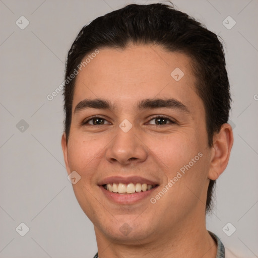 Joyful white young-adult male with short  brown hair and brown eyes