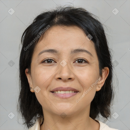 Joyful asian adult female with medium  brown hair and brown eyes