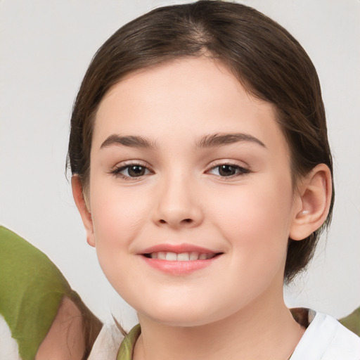 Joyful white child female with medium  brown hair and brown eyes