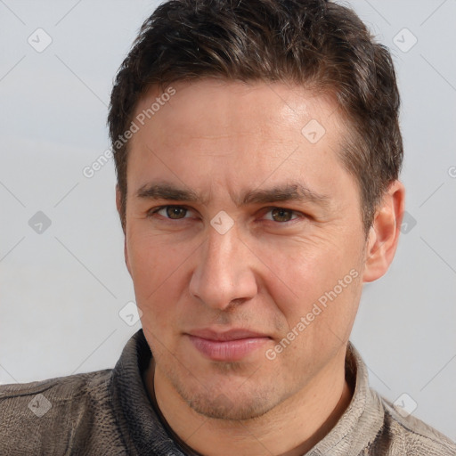 Joyful white adult male with short  brown hair and brown eyes