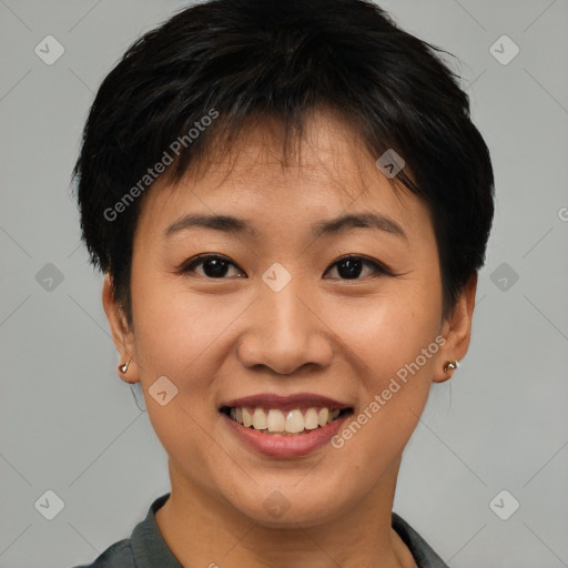 Joyful asian young-adult female with short  brown hair and brown eyes