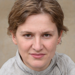 Joyful white young-adult female with medium  brown hair and blue eyes