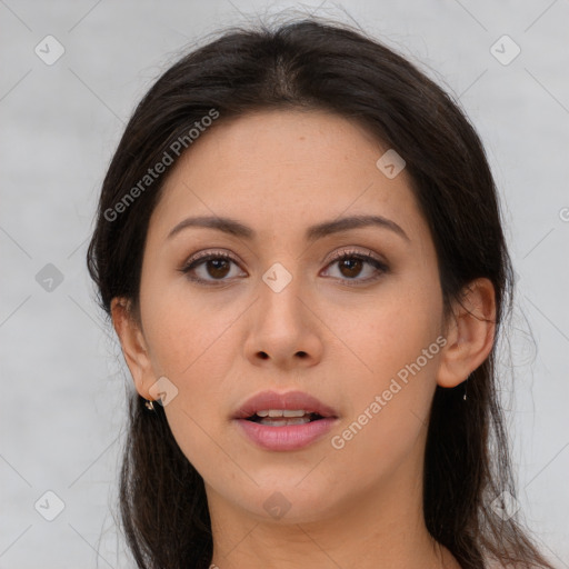 Joyful asian young-adult female with long  brown hair and brown eyes