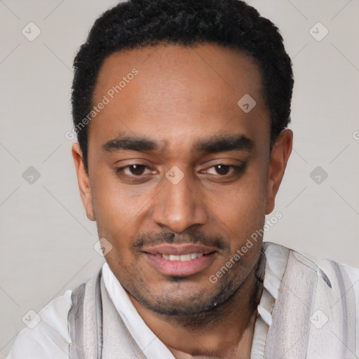Joyful black young-adult male with short  black hair and brown eyes