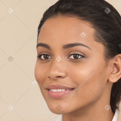 Joyful latino young-adult female with medium  brown hair and brown eyes