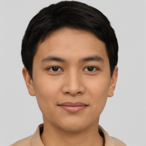 Joyful asian young-adult male with short  black hair and brown eyes
