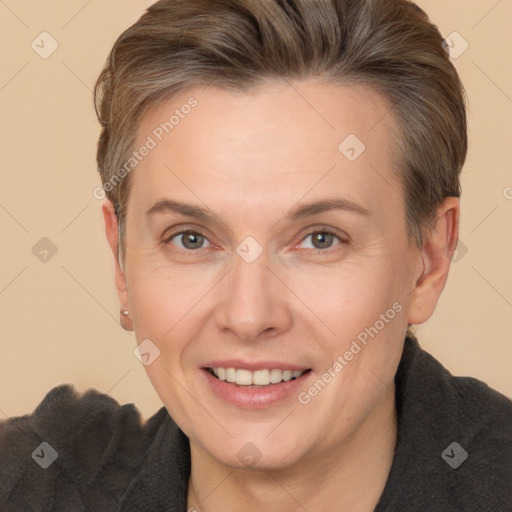 Joyful white adult female with short  brown hair and brown eyes