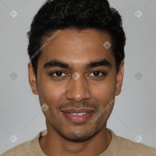 Joyful black young-adult male with short  black hair and brown eyes